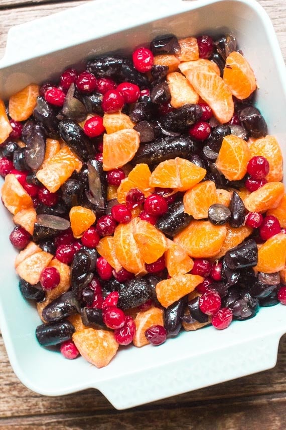 fruit filling for Low FODMAP Cranberry Crisp with Grapes & Citrus in a light blue baking dish