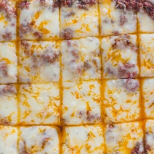 overhead image of low FODMAP lasagna in white dish against white background