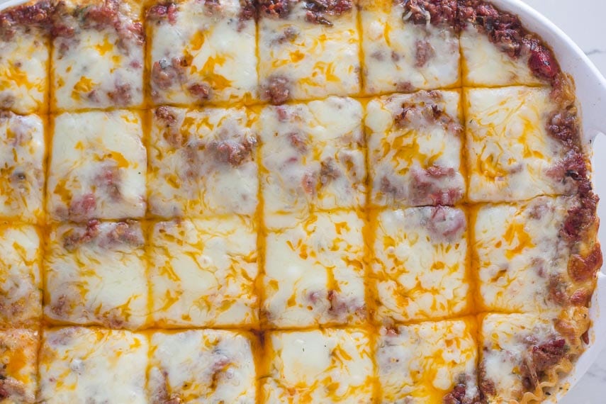 overhead image of low FODMAP lasagna in white dish against white background