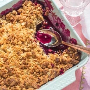 overhead of low FODMAP cranberry crisp in light blue ceramic baking dish