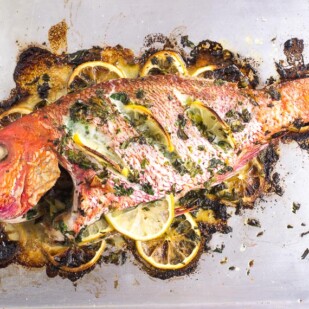 Low FODMAP Whole Roast Fish on sheet pan stuffed with lemons and herbs