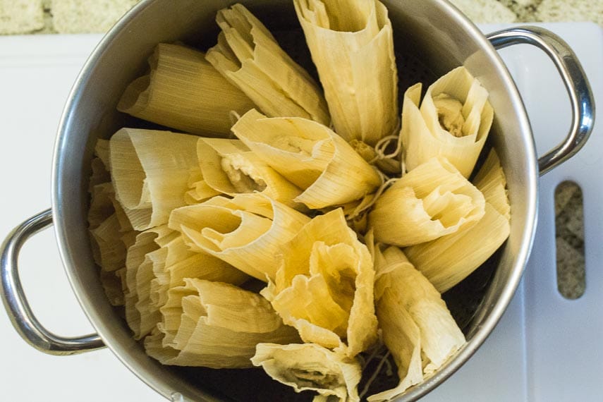 Tamales, standing upright in steamer, ready to cook