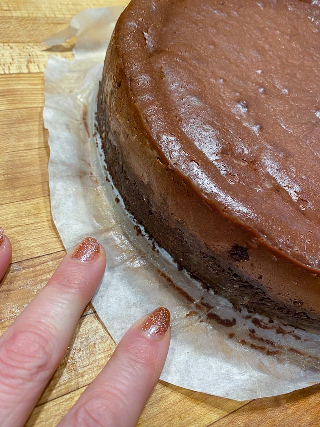 unmolding chocolate cheesecake from springform pan