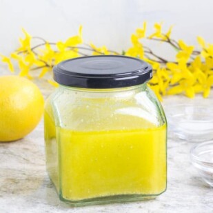 Low FODMAP Lemon Salad Dressing in a clear jar with lid