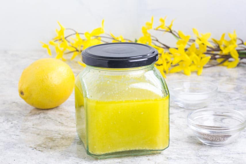 Low FODMAP Lemon Salad Dressing in a clear jar with lid