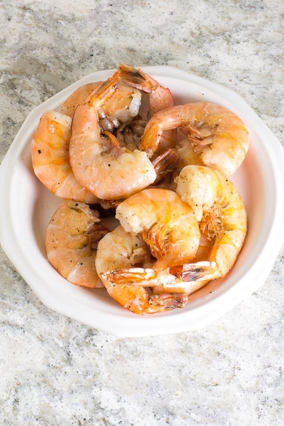 No FODMAP sauteed shrimp on white plate