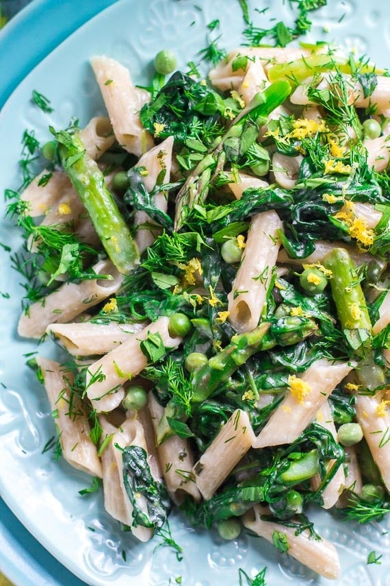 closeup of low FODMAP pasta primavera on aqua colored plates