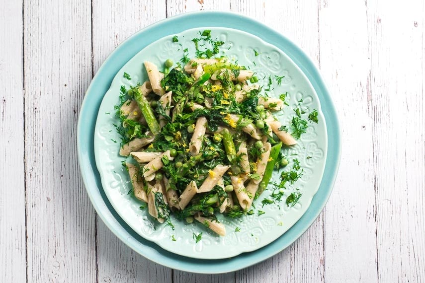 overhead Low FODMAP Pasta Primavera on aqua plates