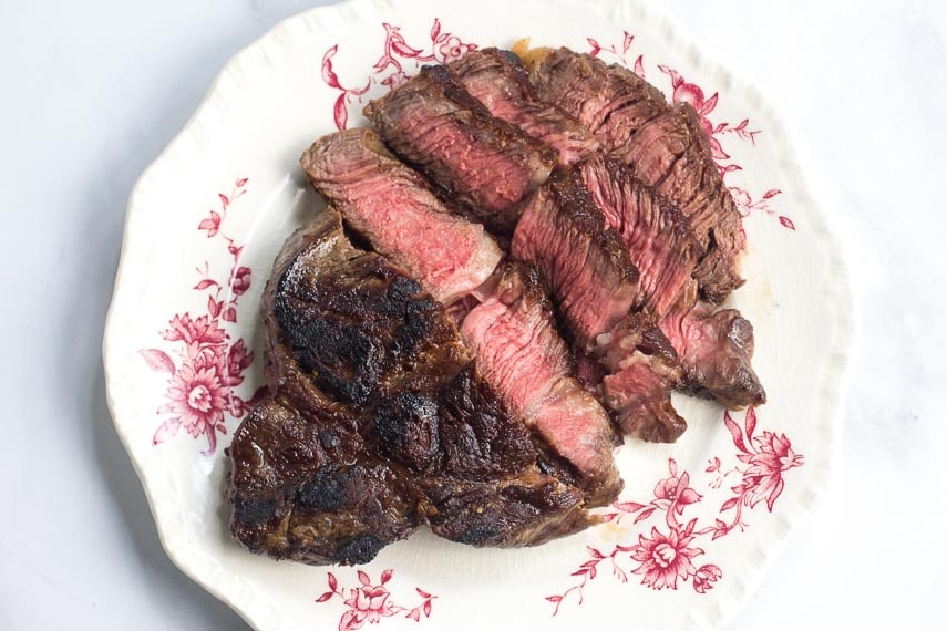 No FODMAP Steak on a decorative plate against white background