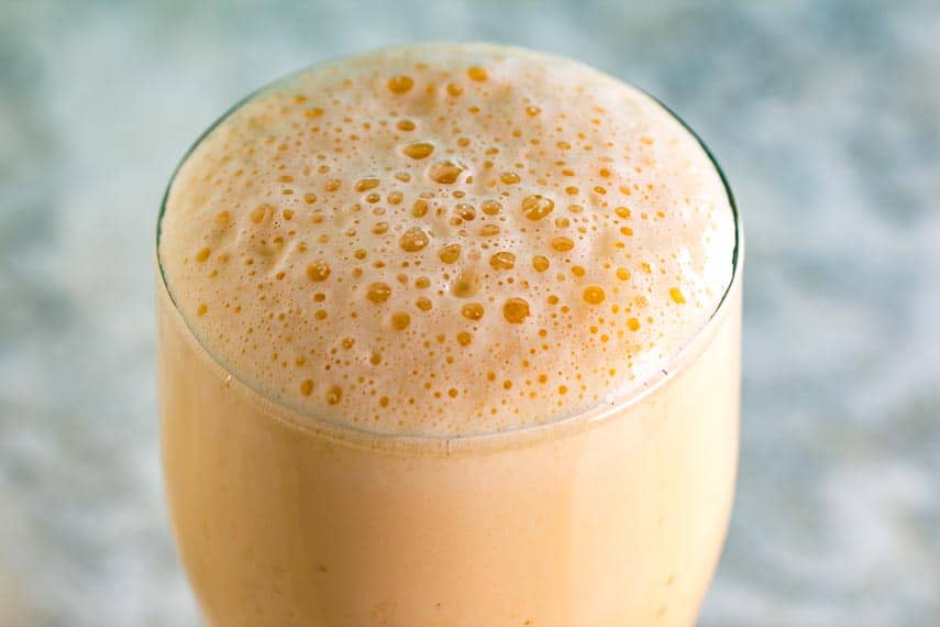 Closeup of frothy top of our Version #3 of our Low FODMAP Orange Carrot Juice