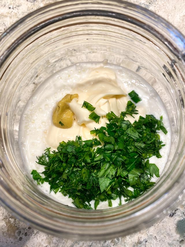 Ingredients for Low FODMAP Ranch Dressing in a jar about to be combined