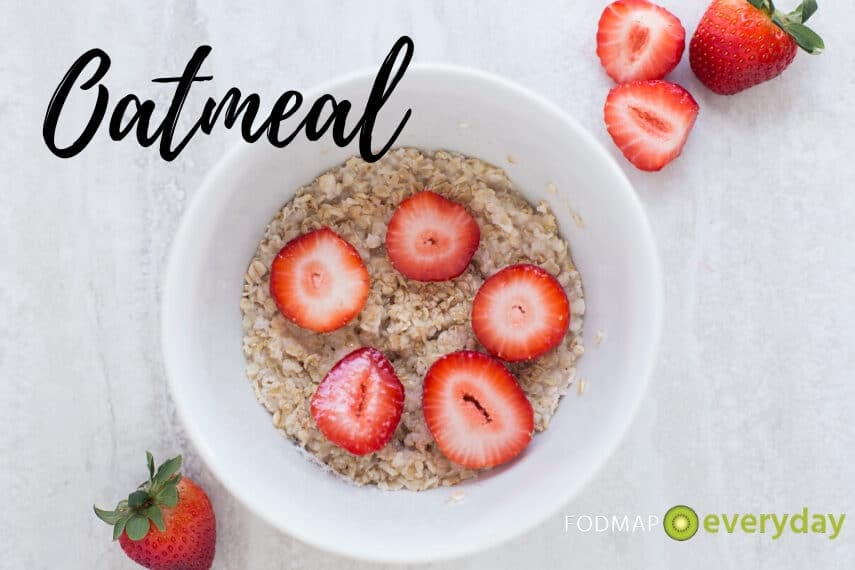 An overhead shot of a bowl of oatmeal with strawberries