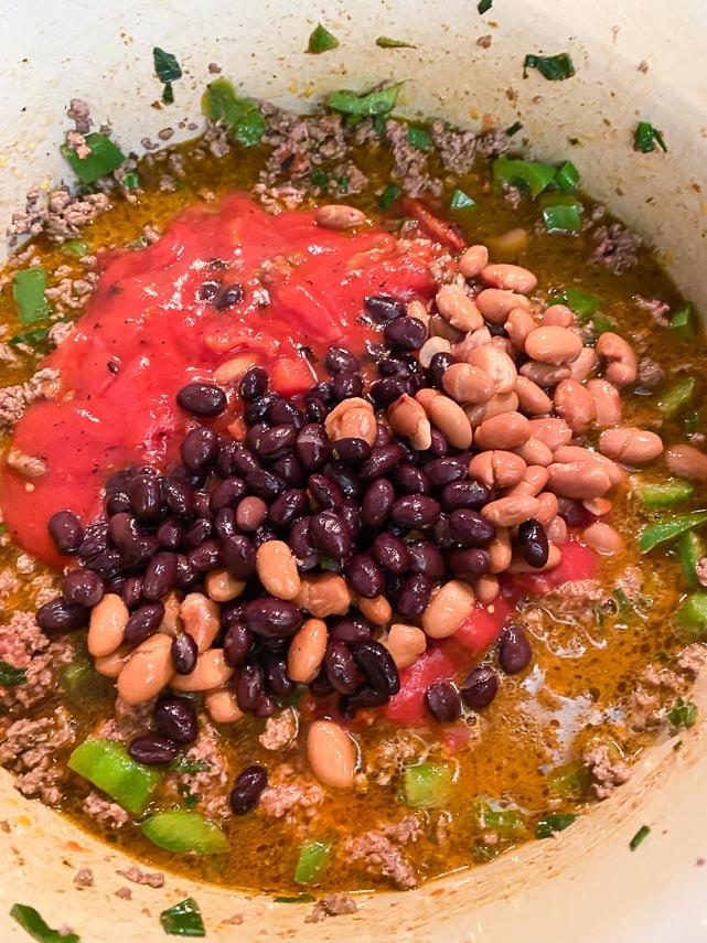 add tomato sauce, broth and beans