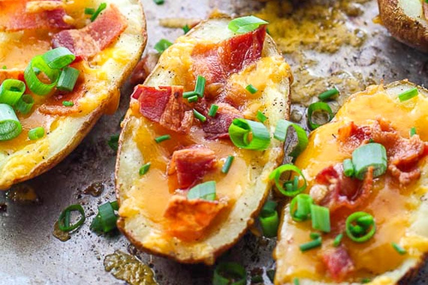 close image of low FODMAP stuffed potato skins with melted cheese