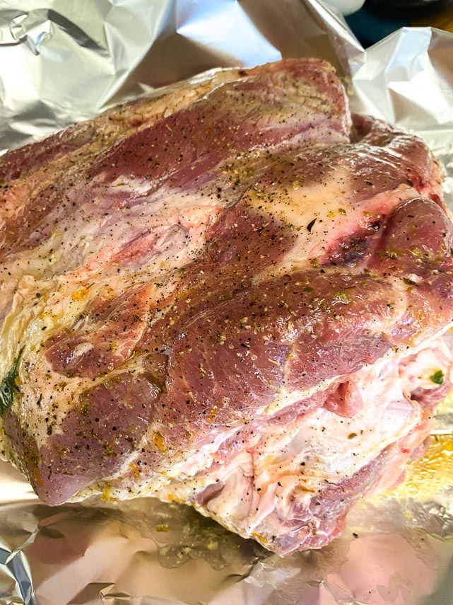 combining marinade and raw pork in foil packet for Low FODMAP Cuban-Style Roast Pork