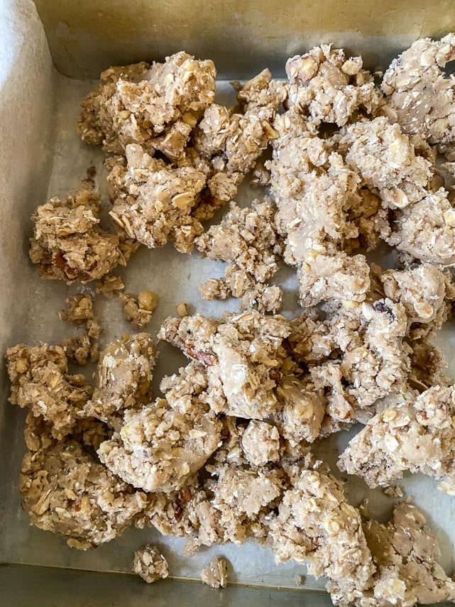 scatter half the dough on bottom of pan for Low FODMAP Strawberry Oat Bars_