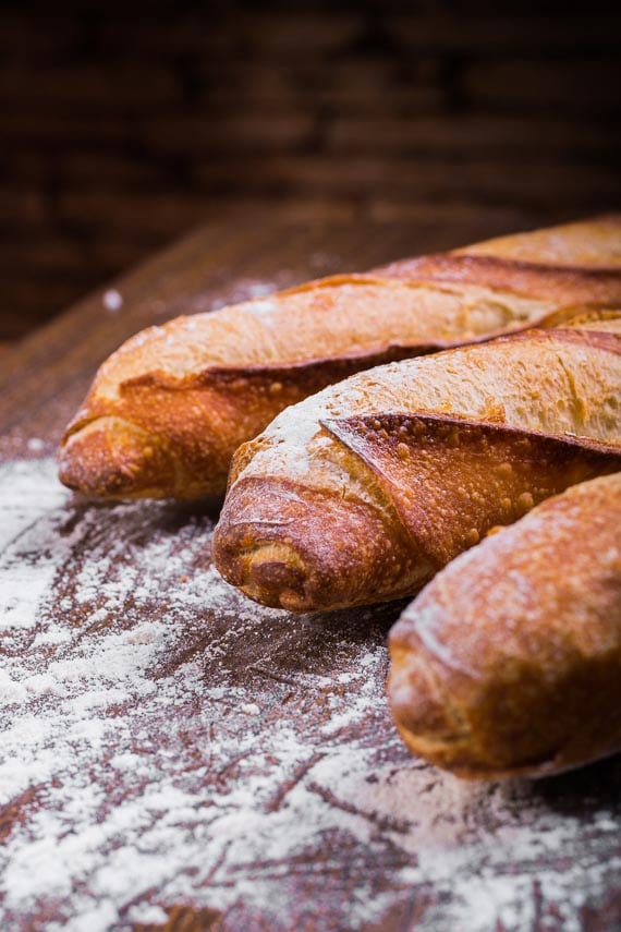 close-up-photo-of-three-baguettes-on-brown-wooden-surface-1387070