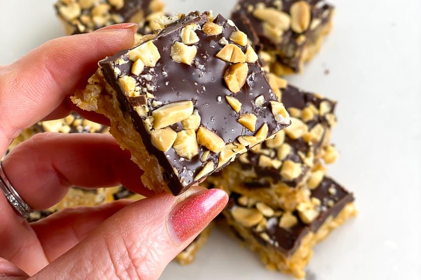 closeup of Low FODMAP Chunky Rice Krispie Treat held in manicured hand