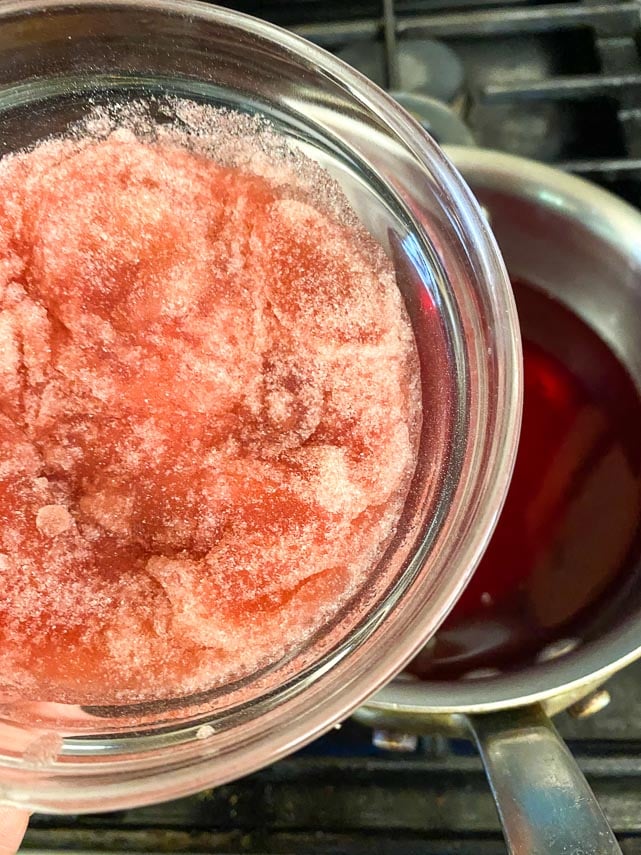 Juice heating in a saucepan; getting ready to add softened gelatin