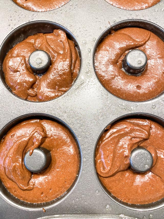 baked chocolate doughnut batter in pans