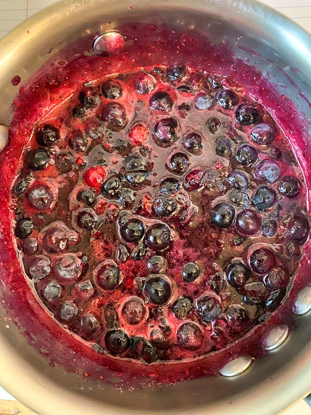 blueberry sauce cooking for trifle