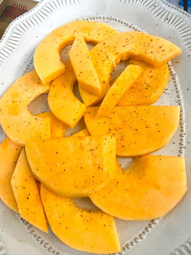 cantaloupe in a large oval platter, seasoned with salt and pepper