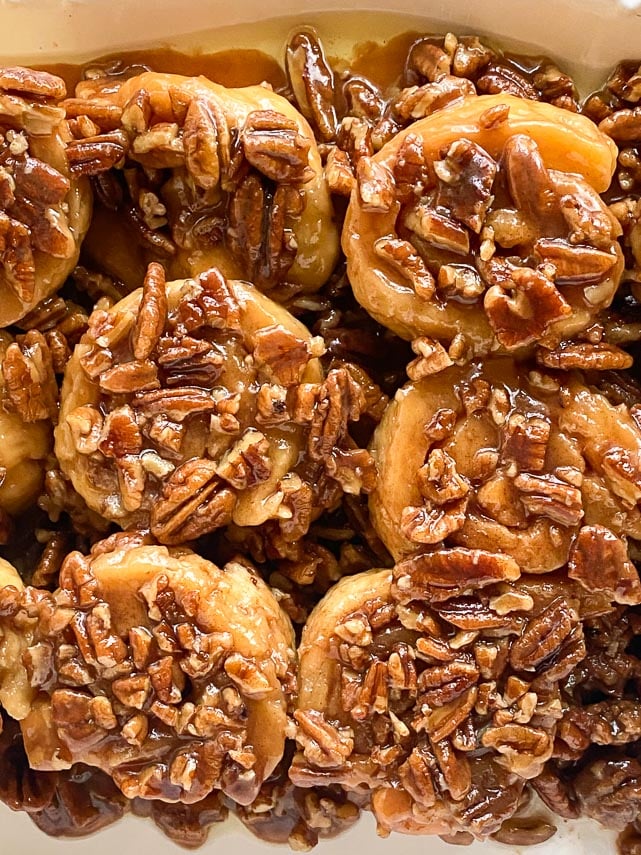 closeup of low FODMAP gluten-free caramel pecan sticky buns on white platter-2