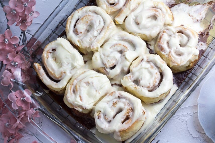 horizontal image of low FODMAP Cinnamon Rolls in a glass pan