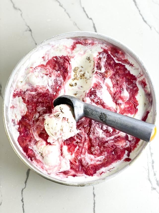 overhead shot of rhubarb crumble ice cream in freezer container