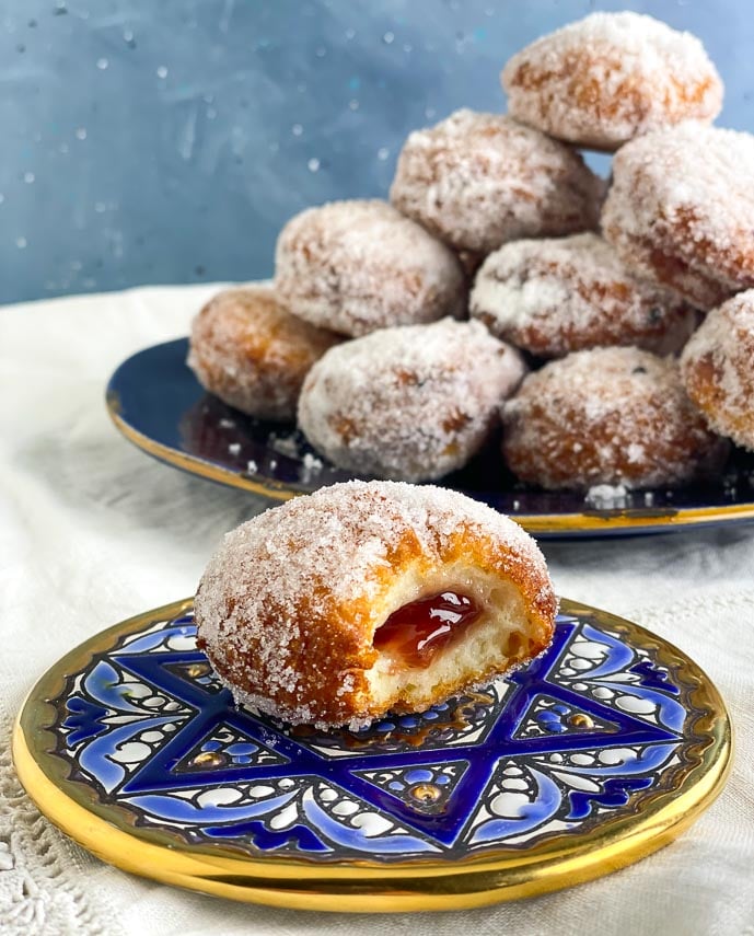 vertical image of low FODMAP Jelly donuts, filled with strawberry jelly