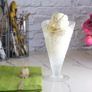 Low FODMAP No-Churn Vanilla Ice Cream in glass dish that looks like an ice cream cone