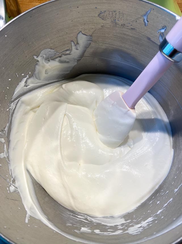 adding sweetened condensed milk to whipped cream; first use a whisk to incorporate, then change to a spatula