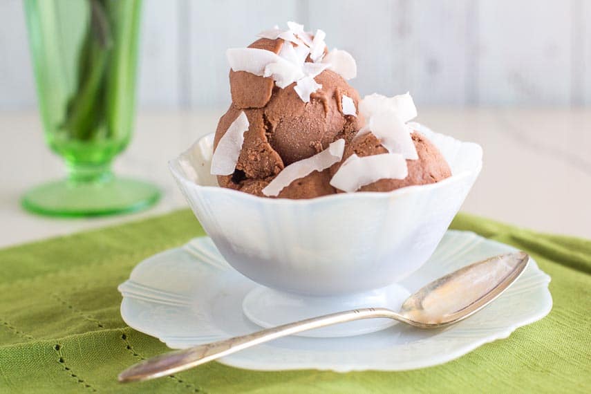 low FODMAP chocolate coconut sorbet in decorative white glass dish with green napkin_