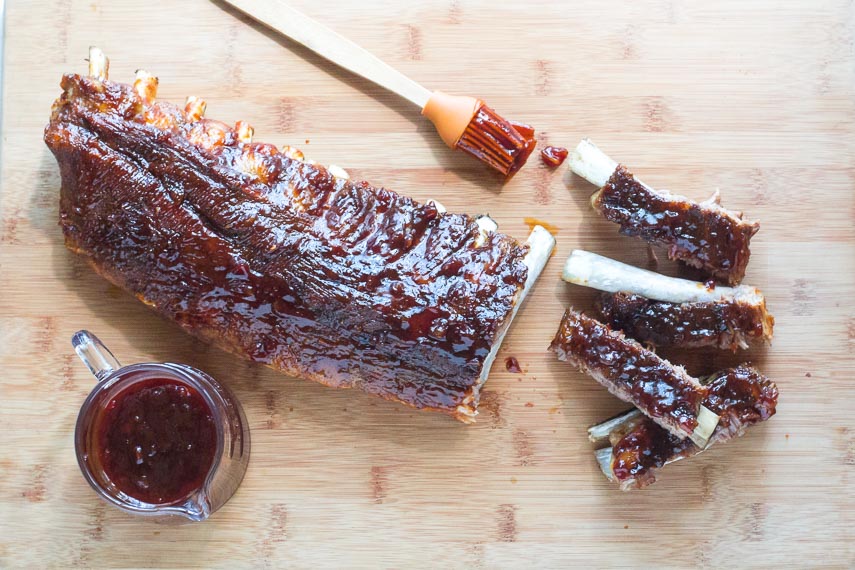 overhead view of Low FODMAP Pineapple Whiskey BBQ Ribs on wooden board