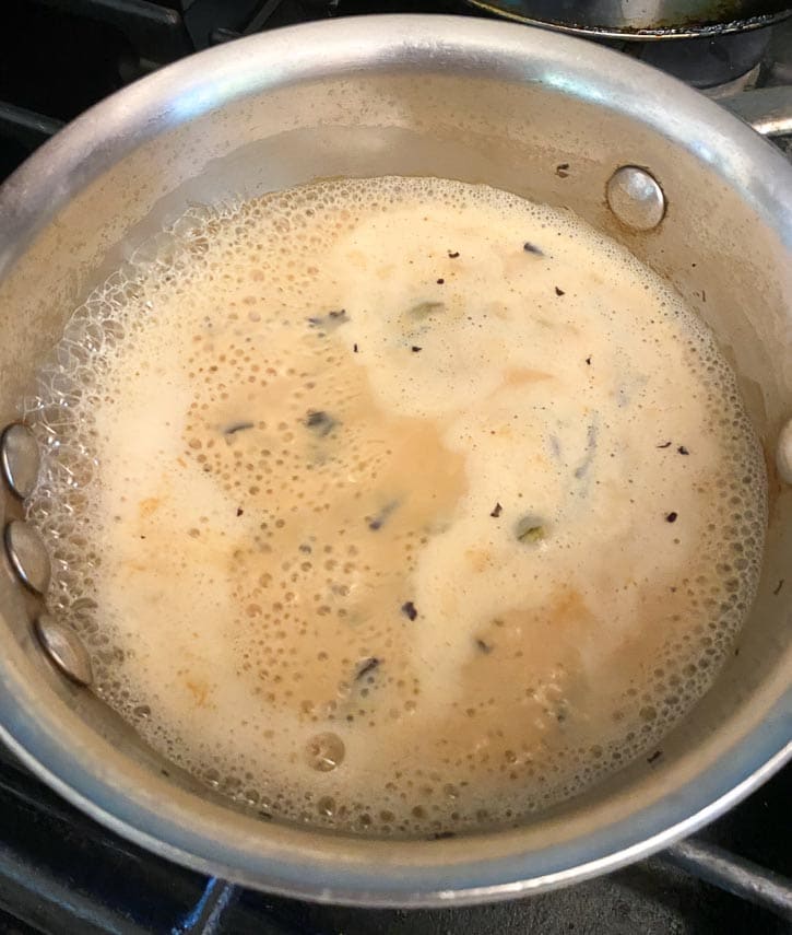 simmering milk in Masala Chai mixture