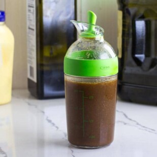 Balsamic vinaigrette in small carafe with spout