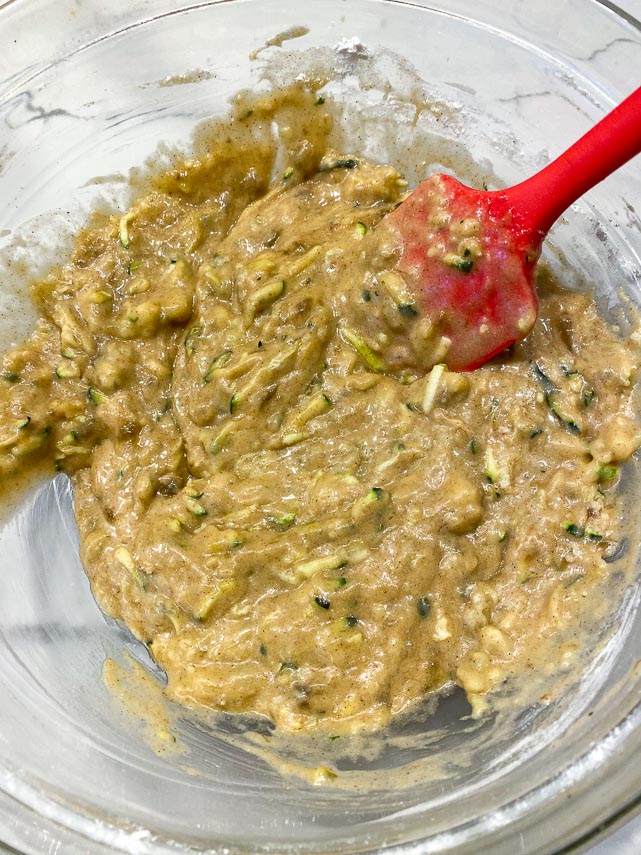 batter for zucchini banana bread mixed together in glass bowl