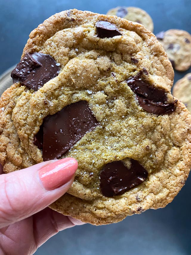 closeup of chocolate chunk cookie held in hand