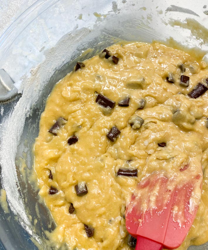 cookie dough blondie batter in bowl with red silicone spatula