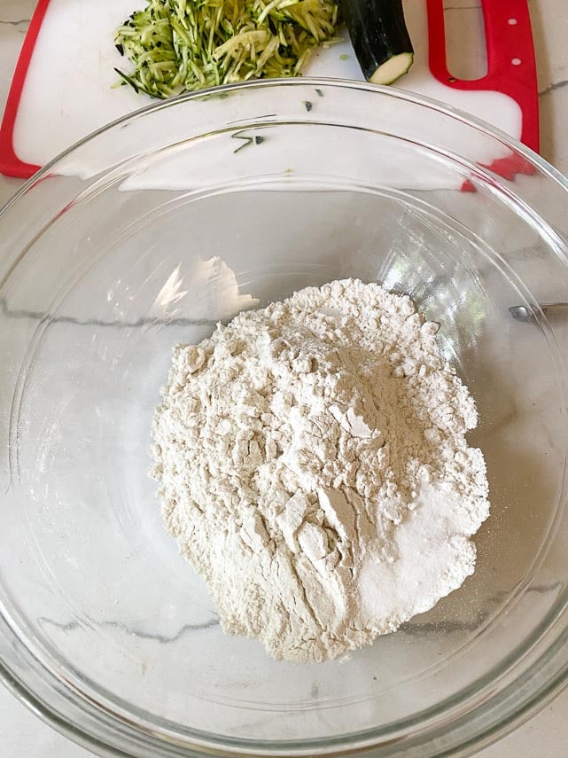 dry ingredients in glass bowl for lemon zucchini bread
