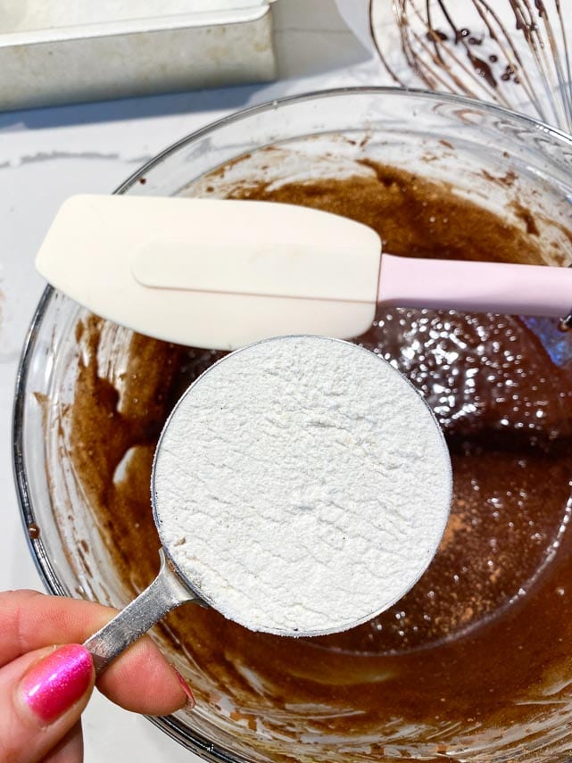 get a silicone spatula ready to fold flour into brownie batter