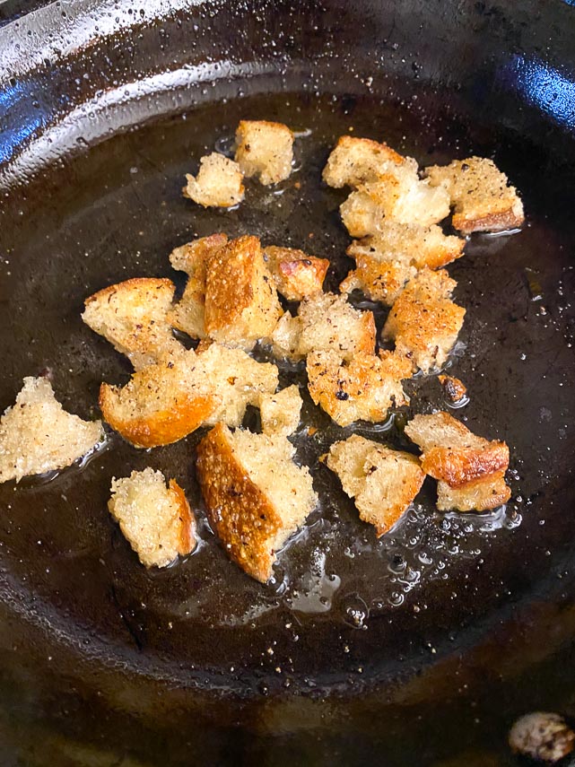 sauteeing sourdough croutons in extra-virgin olive oil