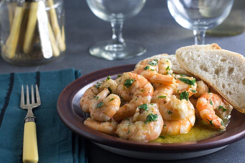 shrimp scampi in a brown plate