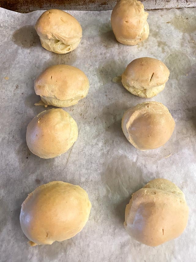 baked cream puffs on parchment lined pan
