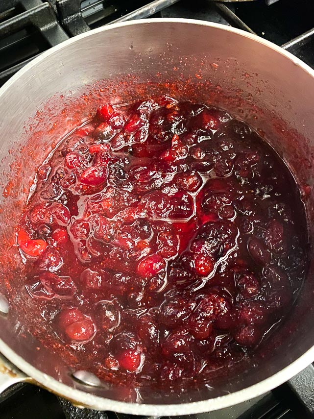 boiling cranberries and sugar together for filling for buche de Noel