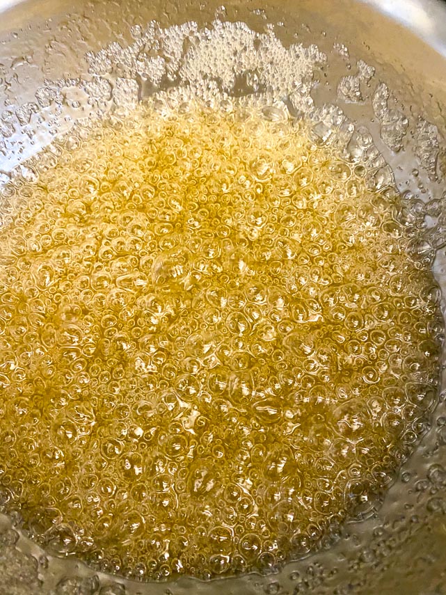 caramel ready in a pot, ready to be turned into spun sugar