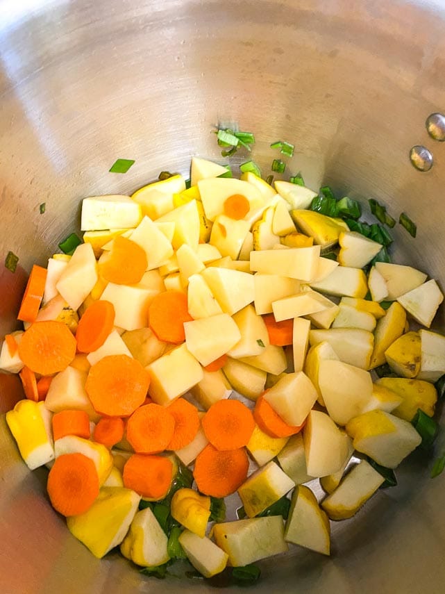 carrots, potatoes and patty pan squash cut into chunks, all together in a pot