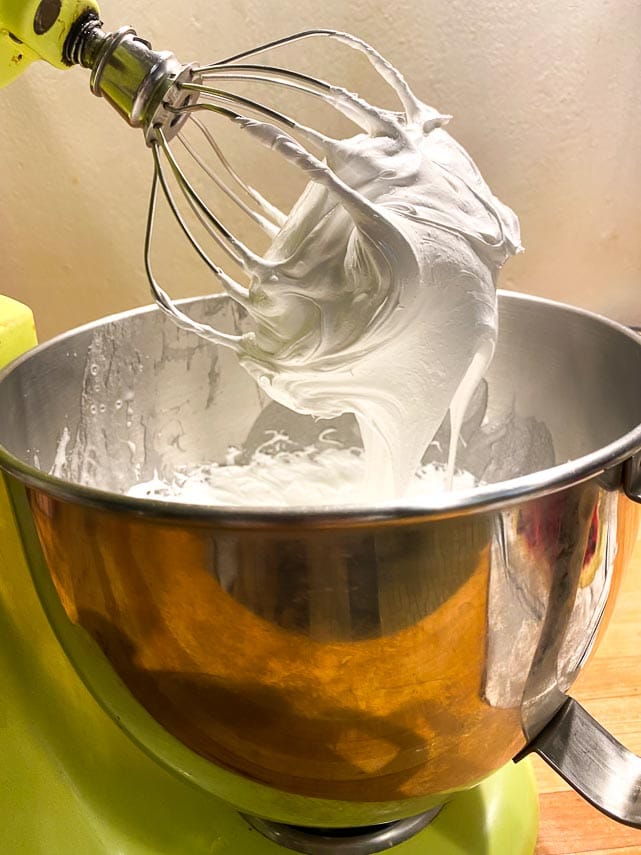 showing a stiff meringue being made in a standing mixer
