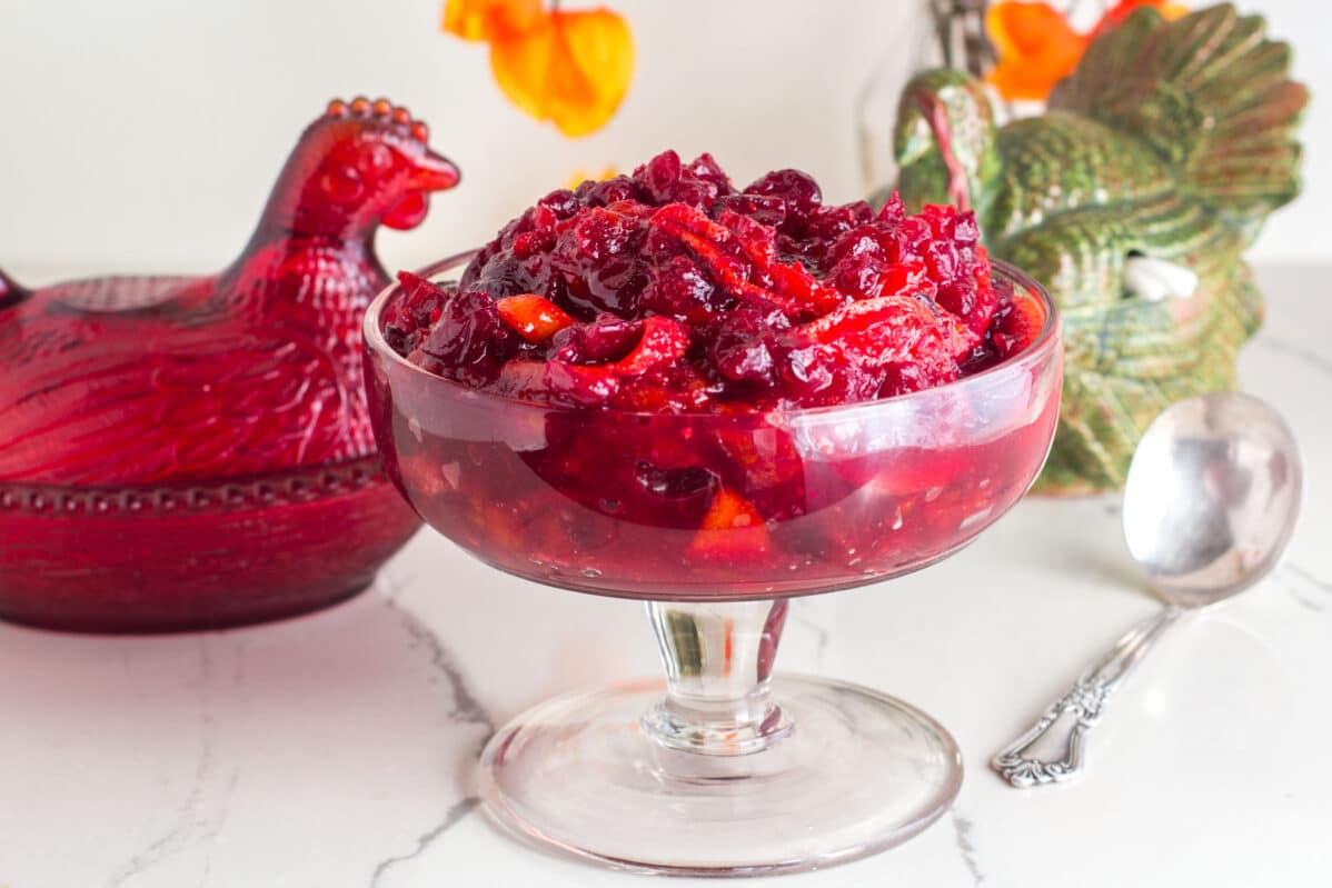 closeup up horizontal shot of cranberry sauce in footed glass dish