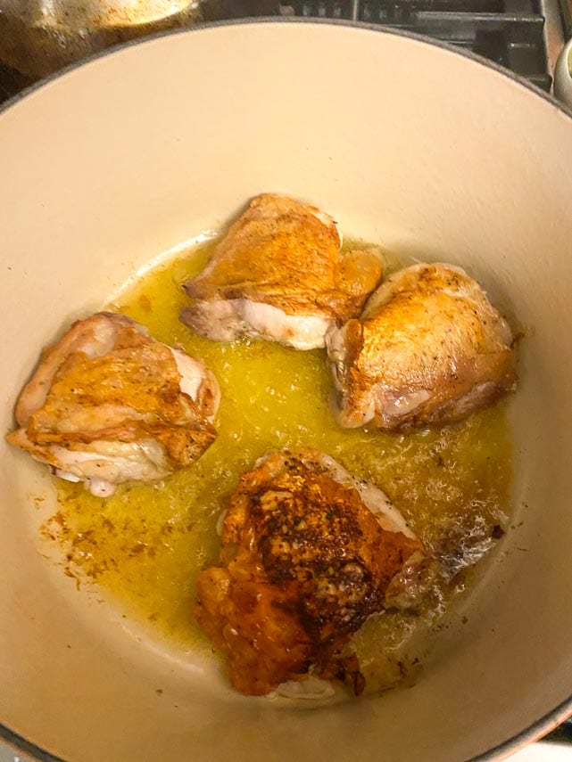 crispy-chicken-thighs-cooking-in-a-Dutch-oven